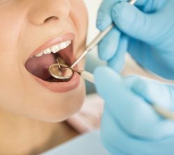 Girl sitting at the dentist's appointment.